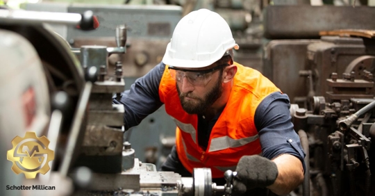 worker using a machine in a warehouse
