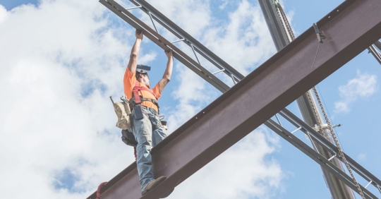 ironworker sitting on a beam
