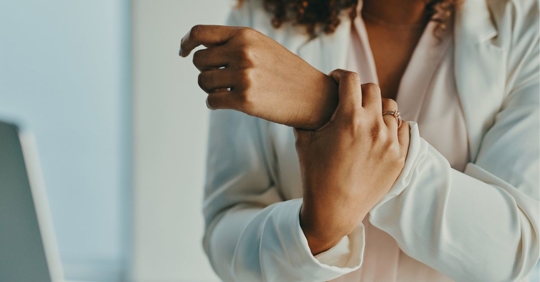 Woman with carpal tunnel holding her wrist