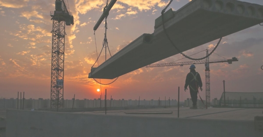 construction worker on top of building