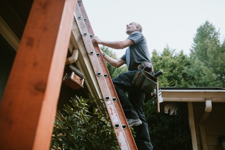 Construction worker on ladder