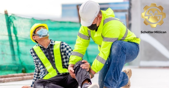 construction worker helping a co-worker after being injured